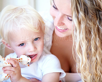 Buy stock photo Smile, mother and baby child with toy, playing and family bonding together for development in home. Mom, toddler and kid with giraffe animal for game, happy and having fun with parent for learning
