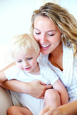 Buy stock photo Mom, toddler and together with love on couch for bonding, learning and relax with safety for kid. Mother, child and support with security for growth, development and family happy in home on sofa