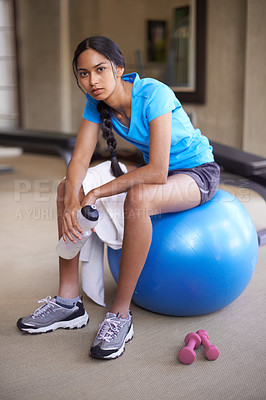 Buy stock photo Portrait, fitness ball and woman with exercise, relax and sweaty with training and endurance. Athlete, sports and girl in a wellness center or healthy with workout and water bottle with rest or peace