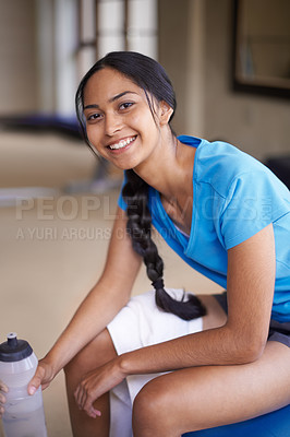 Buy stock photo Woman, portrait and water bottle at gym, relax and hydrate on break from workout at club. Female person, rest and happy for training or exercise, smile and liquid for fitness and nutrition for health