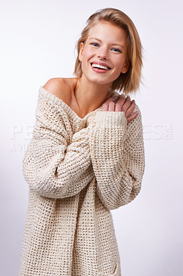 Buy stock photo Woman, winter fashion and portrait in studio for clothing or style on white background or backdrop. Model, smile and pose while isolated for casual, jersey and trendy wear for comfort in Dublin    