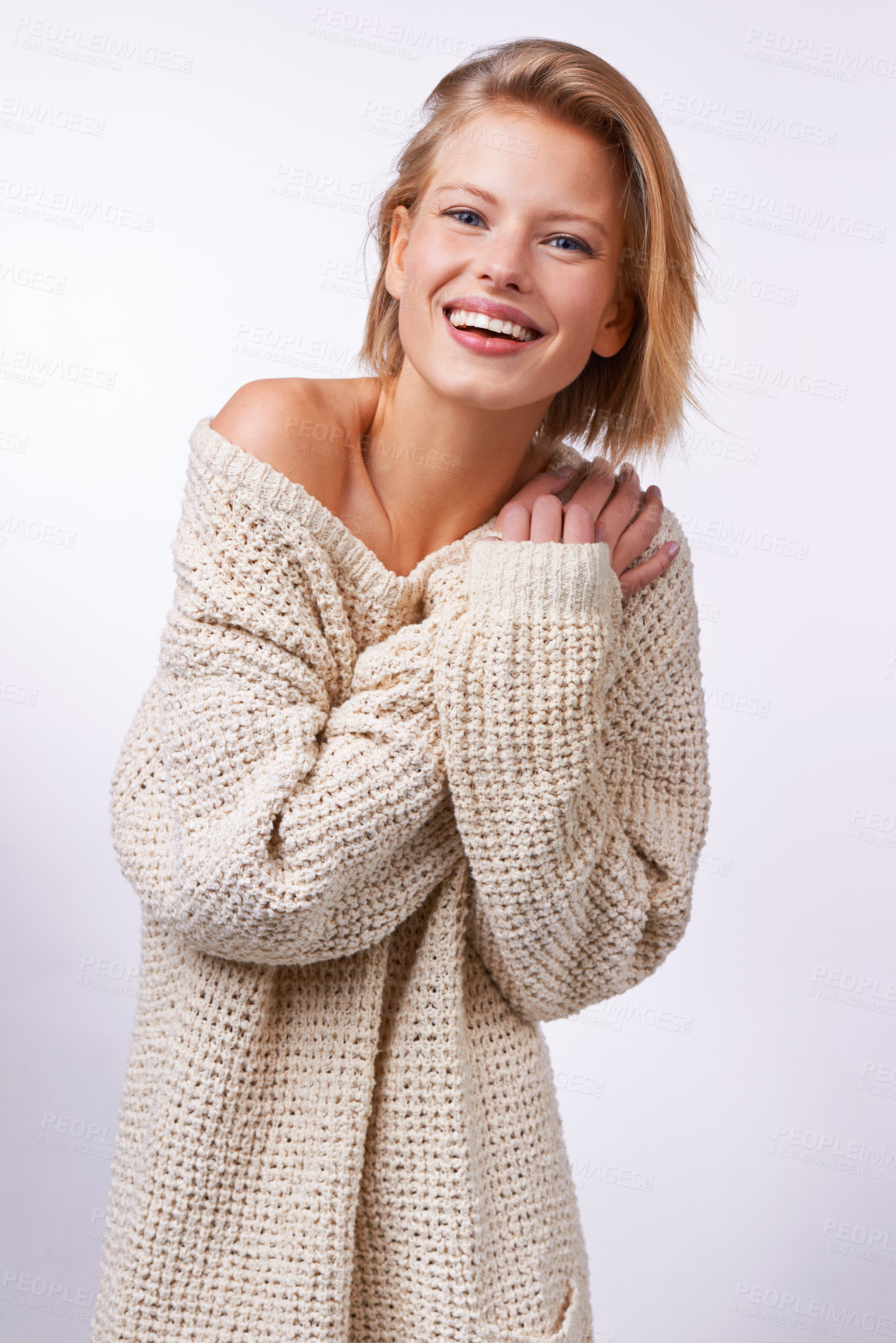 Buy stock photo Woman, winter fashion and portrait in studio for clothing or style on white background or backdrop. Model, smile and pose while isolated for casual, jersey and trendy wear for comfort in Dublin    