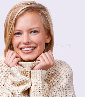 Buy stock photo Female person, smile and cozy in studio with jersey, fashion and winter knitwear for comfort and confident. Woman, style and sweater for face, white background and portrait for beauty and happiness