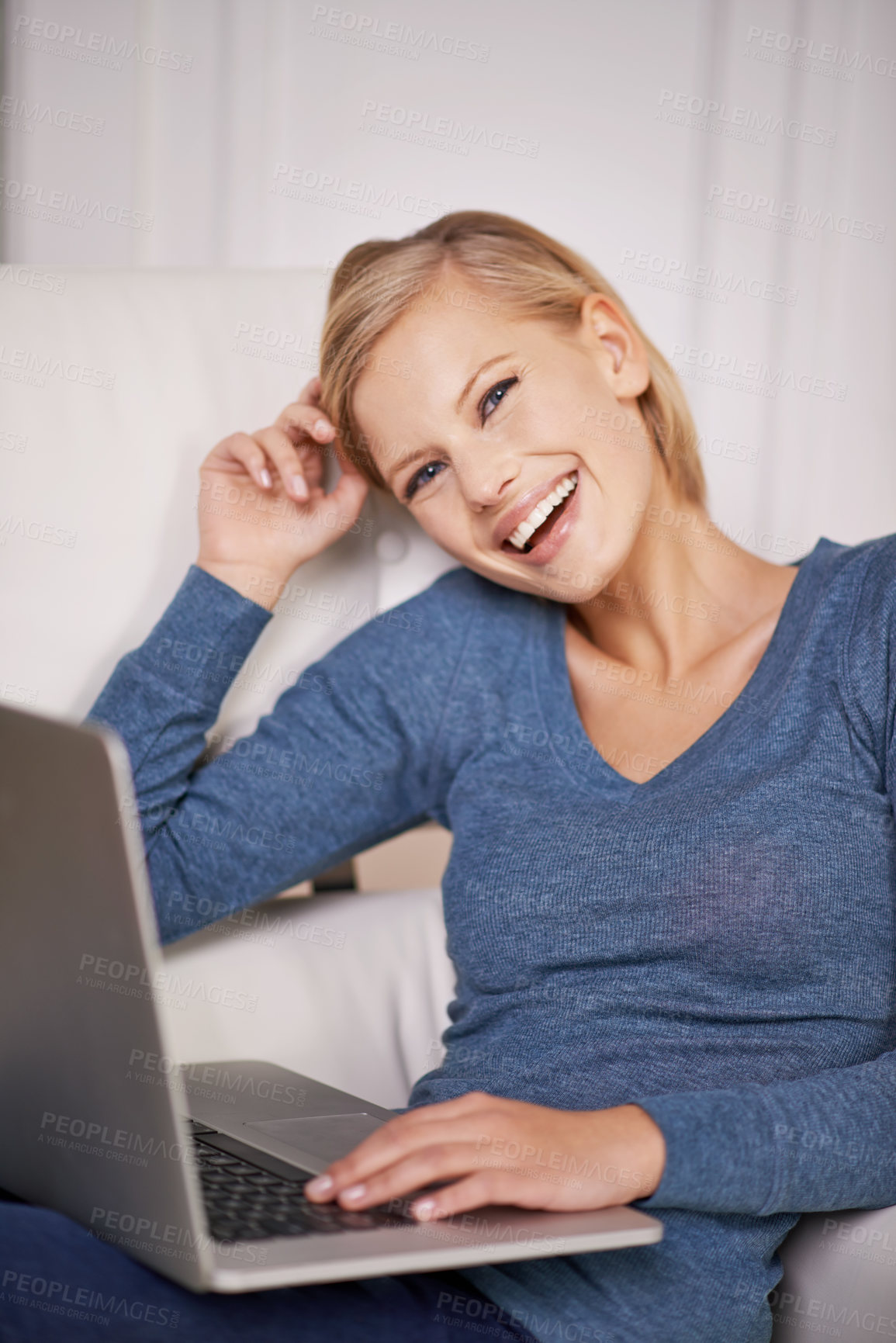 Buy stock photo Portrait of a beautiful young woman sitting with a laptop