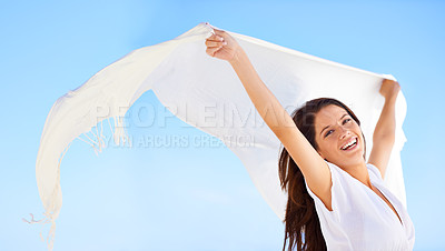 Buy stock photo Portrait, smile and woman with fabric in wind outdoor for summer, vacation or laugh on holiday. Scarf, happy person and fly with silk in the air for freedom, adventure and face in breeze on blue sky