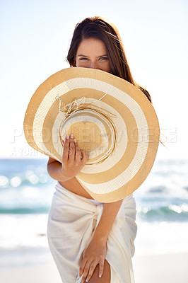 Buy stock photo Woman, portrait and hat on beach in summer for travel, holiday and vacation in Maldives with relax and confidence. Person, tourist and face with beachwear outdoor in nature for adventure and getaway 