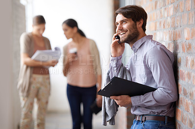Buy stock photo Project, deal or happy businessman on a phone call talking, networking or speaking of ideas in office. Wall, mobile communication or male entrepreneur with smile or portfolio for negotiation offer