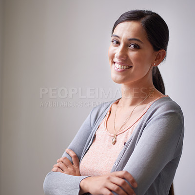 Buy stock photo Portrait of a smiling woman with her arms crossed