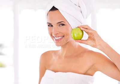 Buy stock photo Happy woman, portrait and natural beauty with apple for nutrition, diet or healthy vitamins at home. Face of young female person or model with smile and organic green fruit for skincare or wellness