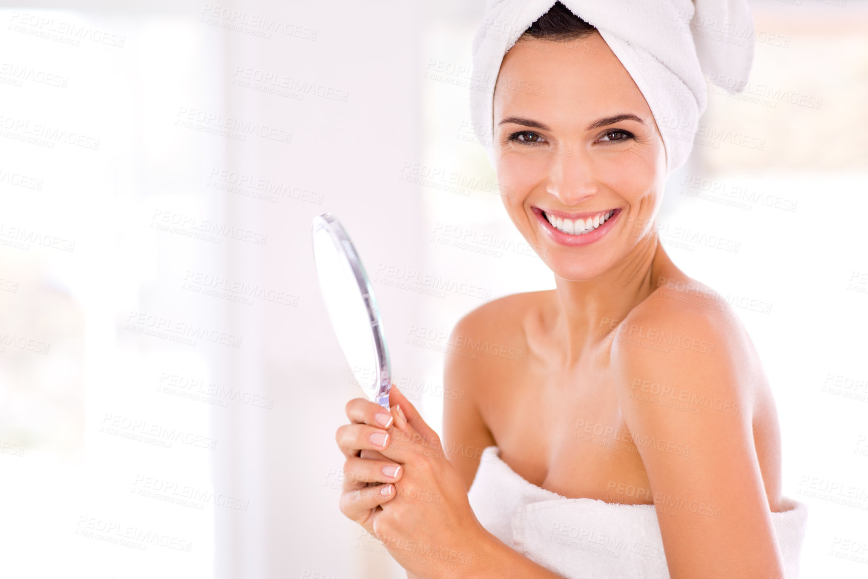 Buy stock photo Portrait of a beautiful woman smiling while holding a hand mirror