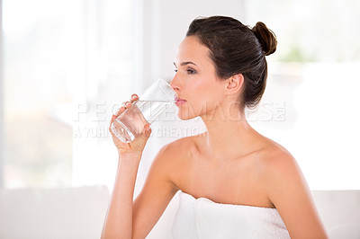 Buy stock photo Home, woman and skincare with glass to drink water in towel, routine and treatment for body care. Female person, bathroom and confident on cosmetics with natural glow, soft and detox with confidence 