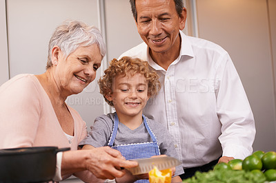 Buy stock photo Smile, happy boy or grandparents teaching cooking skills for healthy dinner with vegetables diet at home. Learning, young male child helping or grandmother with old man, kid or food meal in kitchen