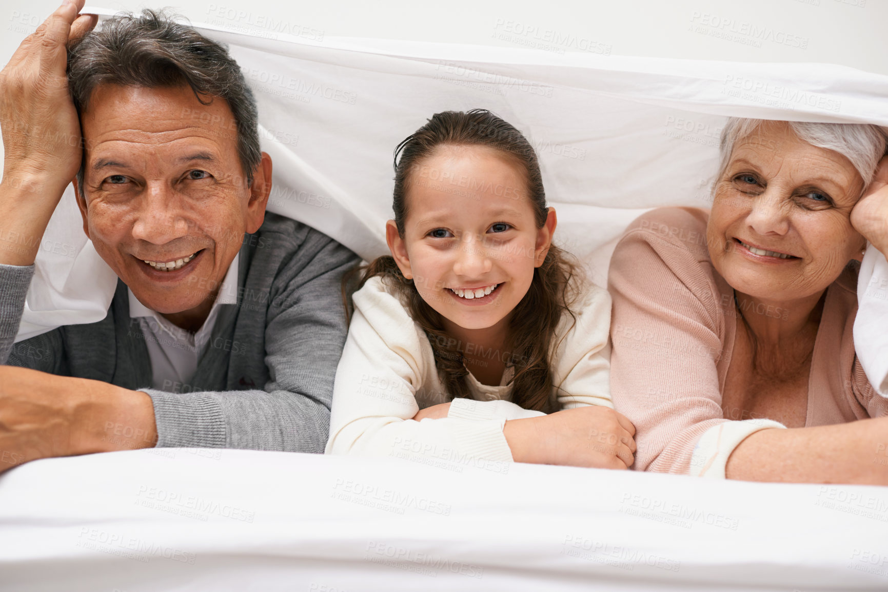 Buy stock photo Portrait, grandparents or happy child in bedroom to relax together for bonding in Australia with love or care. Morning, faces or grandmother with fun girl or old man to enjoy quality time on bed