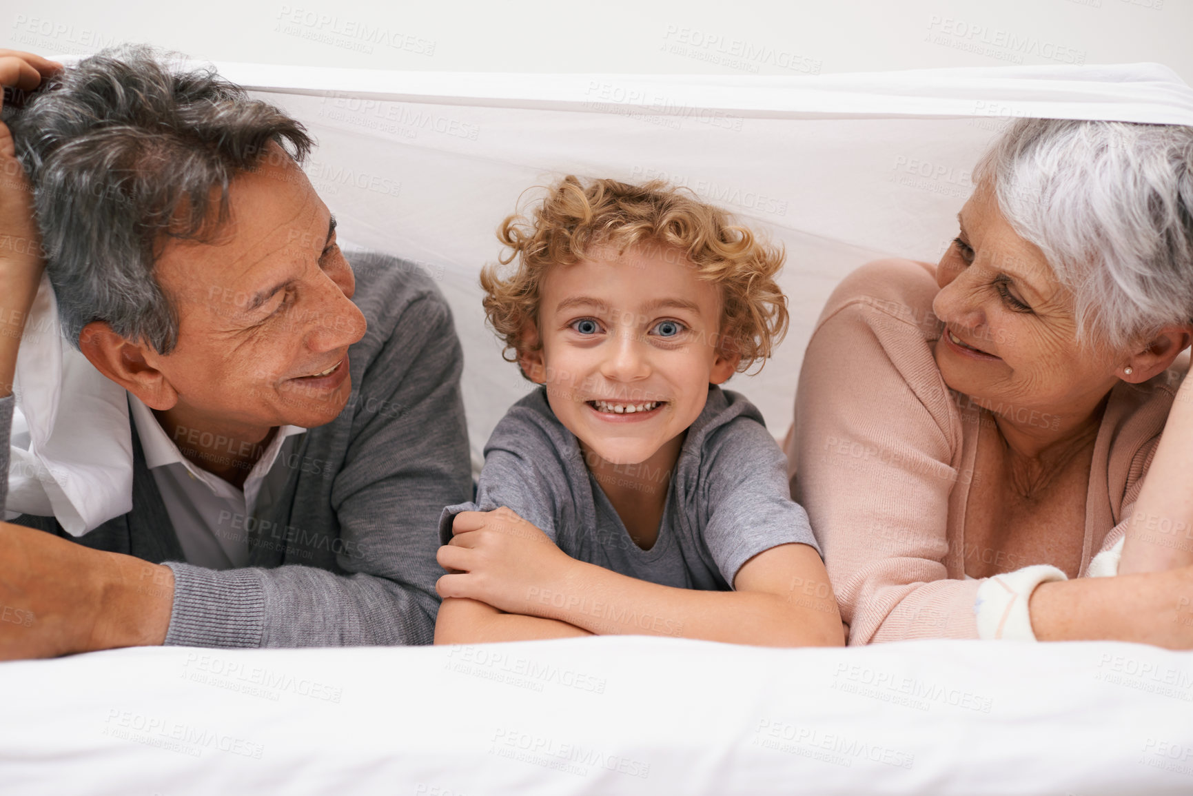 Buy stock photo Portrait, grandparents or happy kid in bedroom to relax together for bonding in Australia with love or care. Morning, faces or grandmother with funny cute boy or old man to enjoy quality bed time 