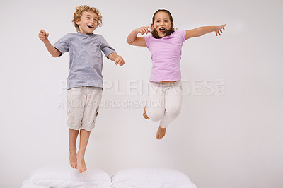 Buy stock photo Jumping, bed and kids with fun, energy and morning in a bedroom with game and sibling. Youth, hop and home with a excited children on a duvet in air with crazy play and leap in house with friends