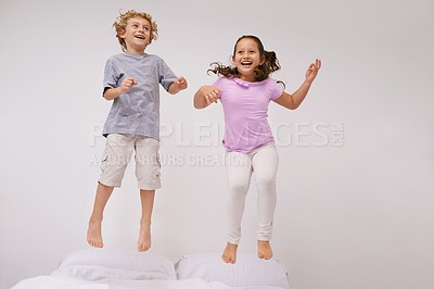 Buy stock photo Jumping, bed and kids with happy, funny and morning in a bedroom with game and sibling. Youth, hop and home with excited children in air with crazy, play and laugh with energy in house with family