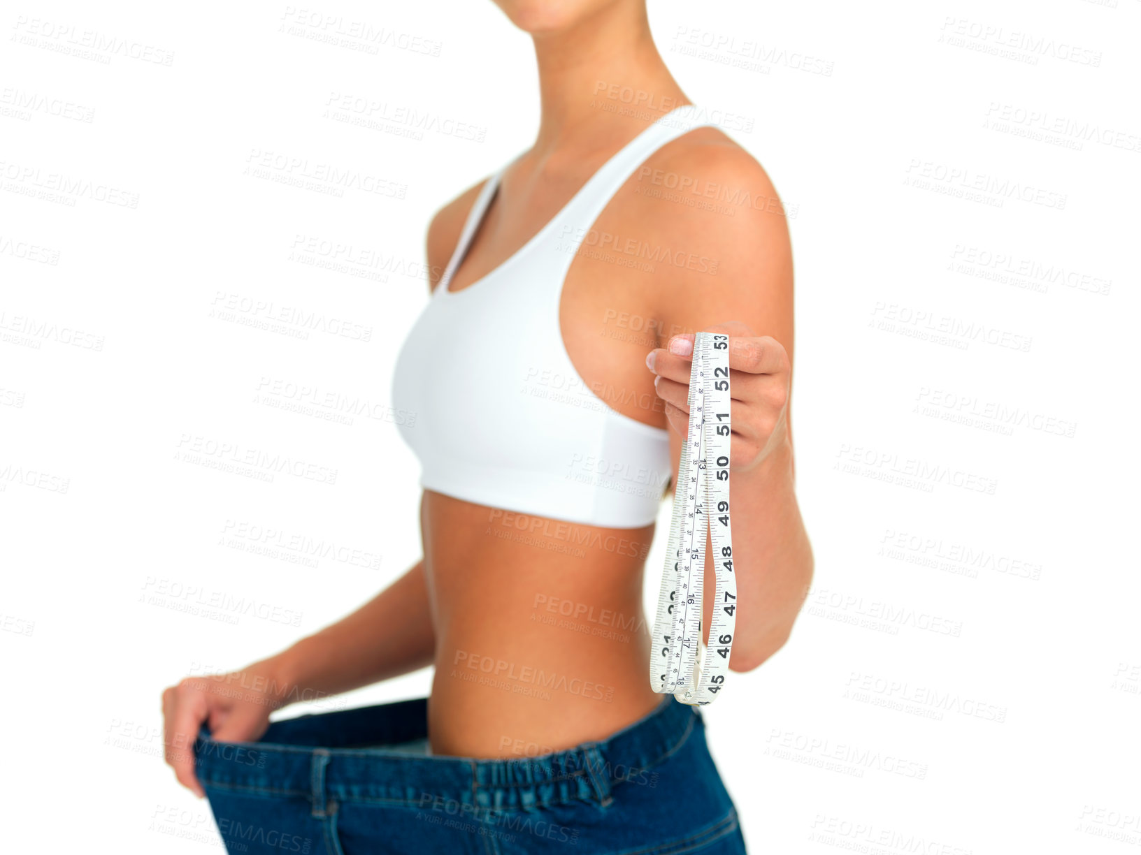 Buy stock photo Diet, weightloss and woman with measuring tape, jeans and tummy tuck with skinny waist, cropped and isolated on white background. Fitness, healthcare and wellness, girl with slim figure measurement.