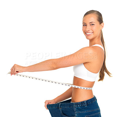 Buy stock photo Portrait, waist and weight loss with a woman measuring her tummty in studio isolated on a white background. Fitness, diet and health with a female holding a tape measure to track her weightloss