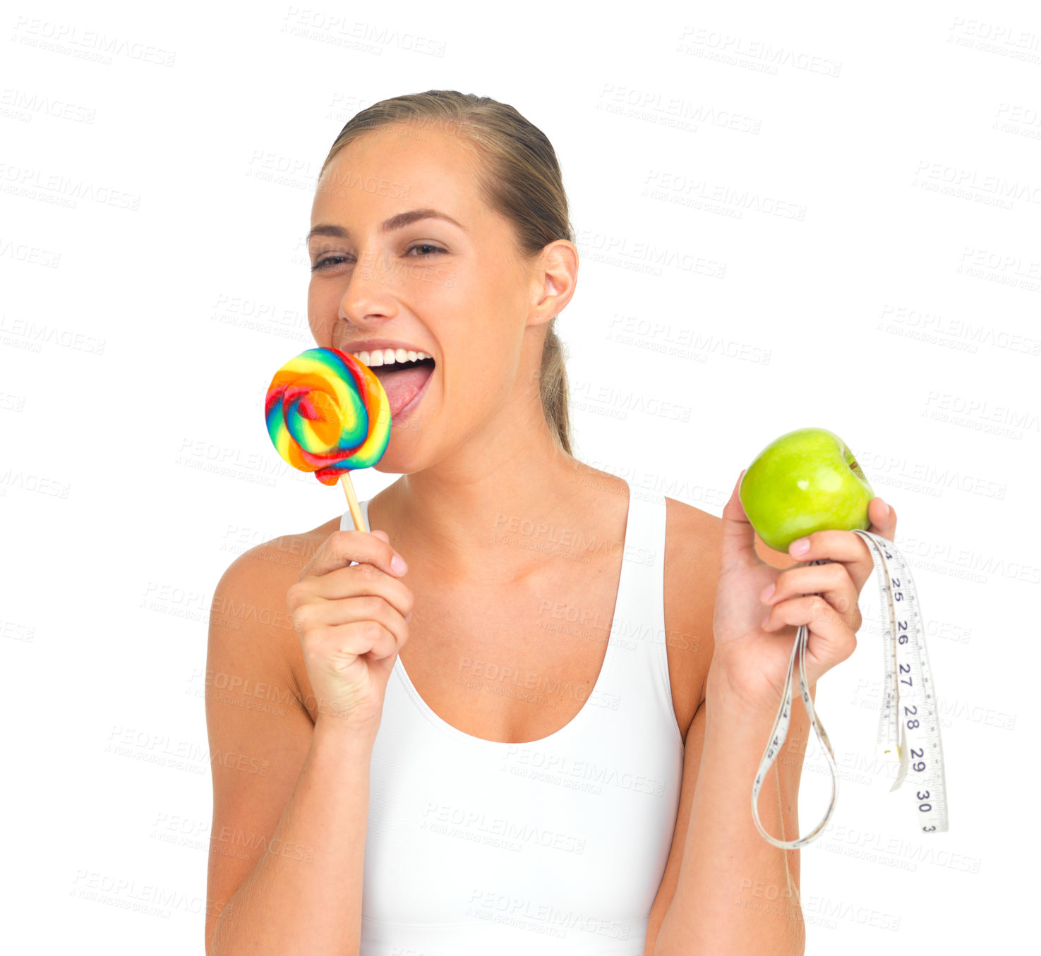 Buy stock photo Diet, weight loss and woman with candy and apple, measuring tape and nutritional choice isolated on white background. Food, health and wellness, happy woman with lollipop and fruit eating in studio.