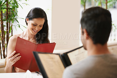 Buy stock photo Couple, restaurant and menu for food selection, fine dining and bonding on valentines day. People, love and romance at cafe or lunch choice for anniversary celebration, cuisine and happy at bistro