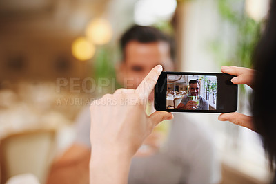 Buy stock photo Restaurant, picture and couple with smartphone, screen and connection with mobile user and photograph. Date, man and woman with cellphone or digital app for memory and romance with Valentines day