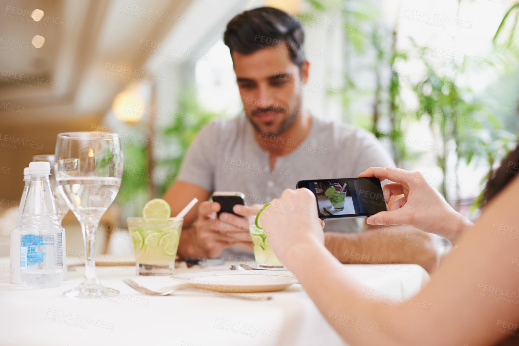 Buy stock photo Restaurant, screen and couple taking picture, food and lunch with digital app and photograph. People, date or couple with cellphone or influencer with social media or love with Valentines day in cafe
