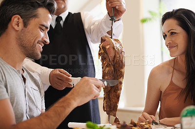 Buy stock photo Couple, server and serving for dinner in restaurant with meat, happiness and fine dining for anniversary or honeymoon. Man, woman and employee with steak on skewer, healthy meal and table in London