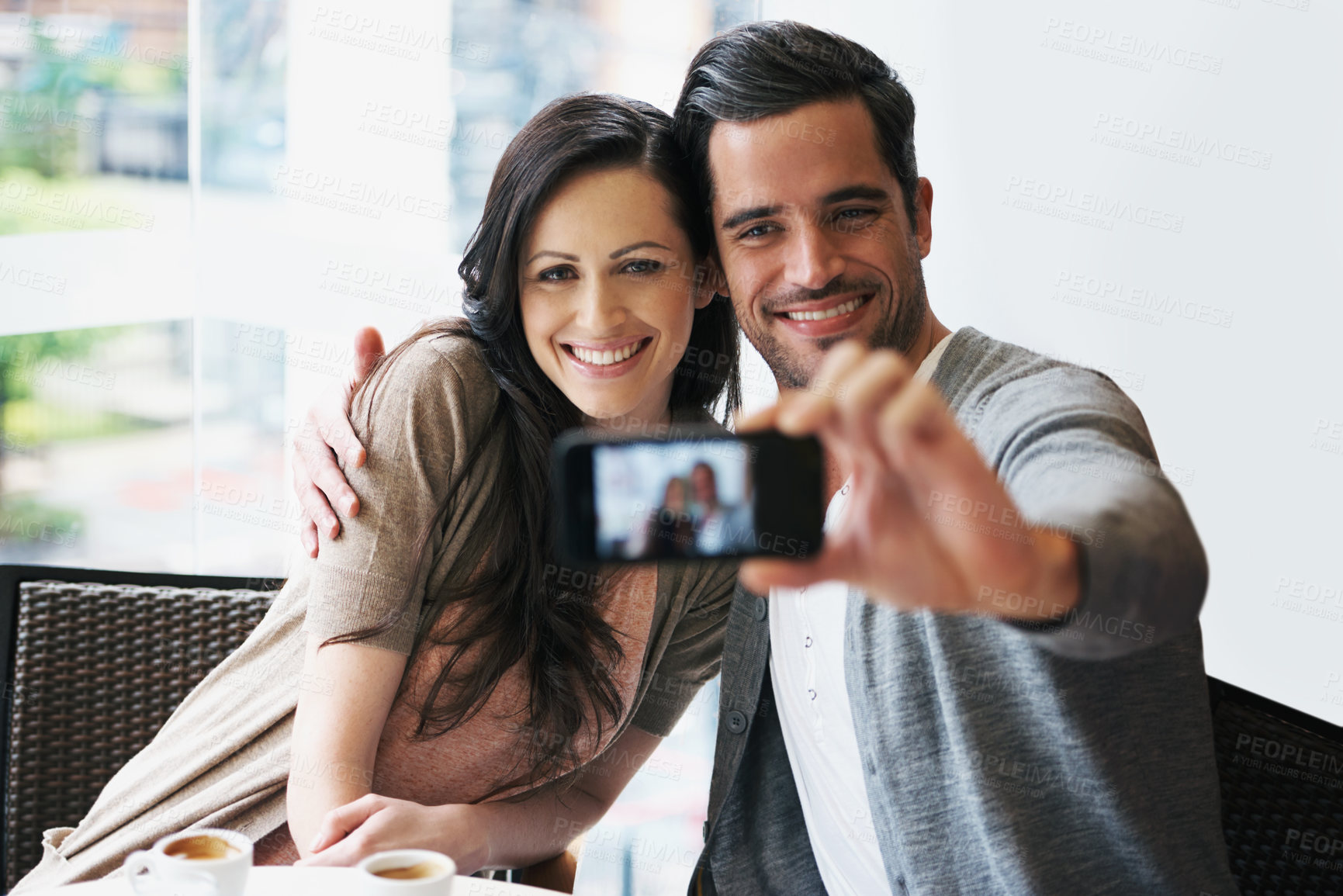 Buy stock photo Couple, smile and date at cafe taking selfie for posting, blog or happy in restaurant with coffee, tea or latte. People, bonding or love together for pictures for social media, online or indoors 