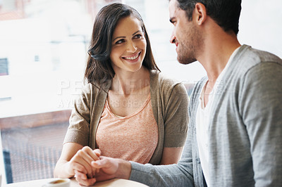 Buy stock photo Couple, holding hands and love on date at cafe, restaurant and coffee shop for connection, bonding and care. Girlfriend, boyfriend or lovers with affection, smile or happy for tea, espresso or drink