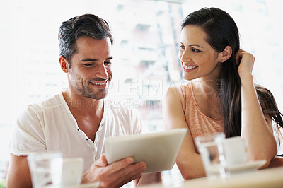 Buy stock photo Happy couple, coffee and relaxing in cafe with tablet, smile and together for romance. Cheerful relationship, man and woman with love connection enjoying, technology and dating in restaurant
