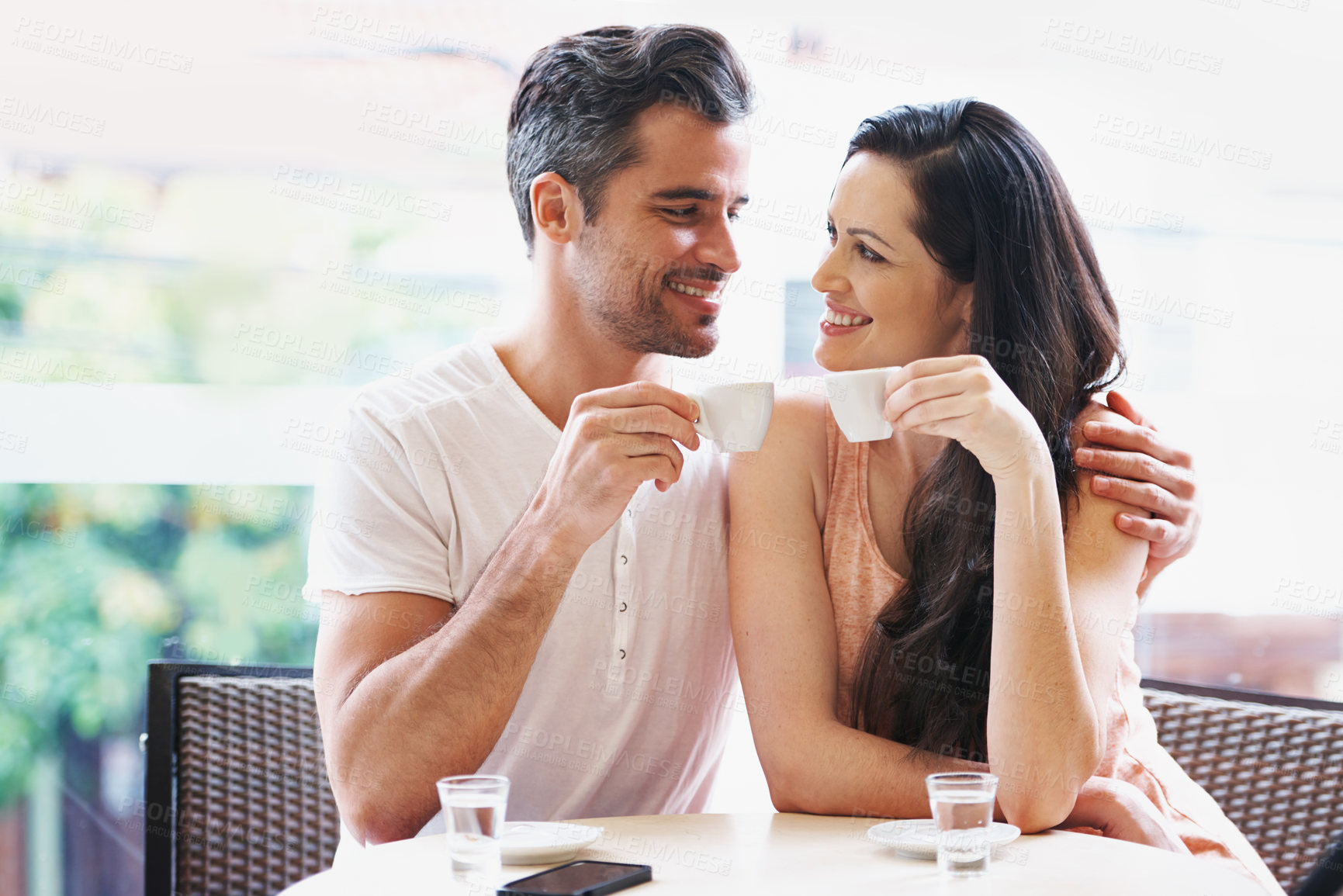 Buy stock photo Date, coffee and couple at cafe with happy, smile and love together with toast and hot drink at a table. Espresso, morning and marriage at a restaurant with bonding, care and romance on patio