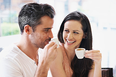 Buy stock photo Happy, discussion and couple with coffee on date for romance or anniversary in cafeteria. Love, bonding and young man and woman talking and drinking latte, espresso or cappuccino at restaurant.