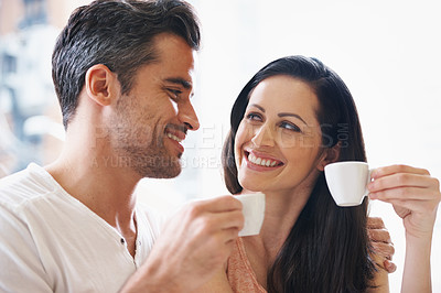 Buy stock photo Talking, smile and couple with coffee on date for romance or anniversary in cafeteria. Happy, bonding and young man and woman in conversation drinking latte, espresso or cappuccino at restaurant.