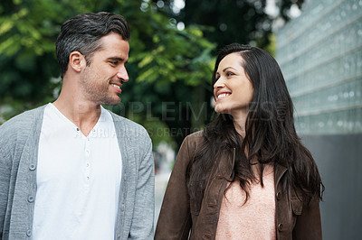 Buy stock photo Romantic, man and woman on street for date, outdoors people and showing love expression. Happy couple, caring and together for walk with smile, fun and cheerful in healthy relationship journey