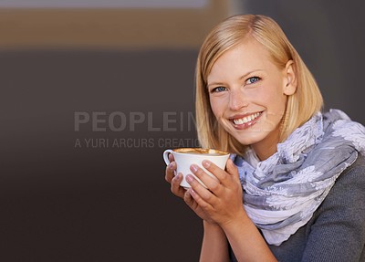 Buy stock photo Portrait of a young woman drinking coffee in a cafe
