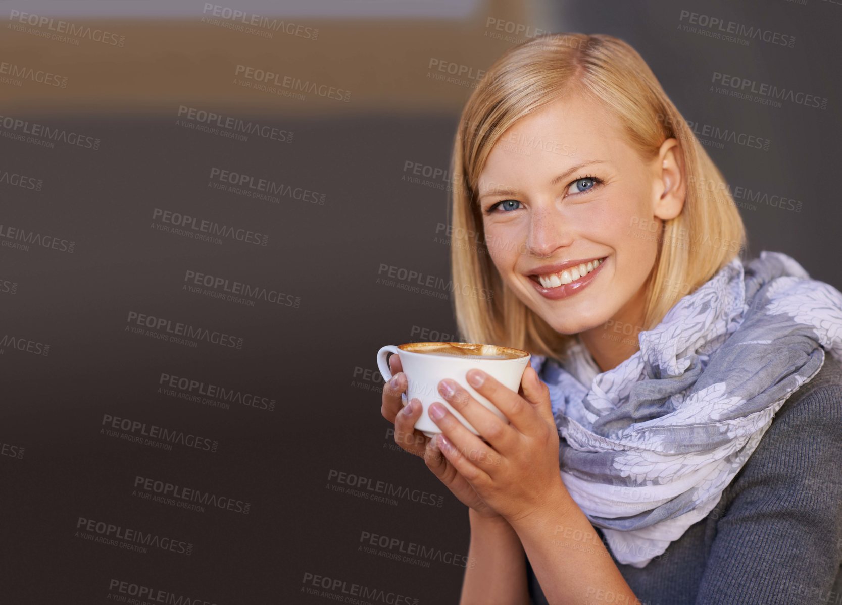 Buy stock photo Portrait of a young woman drinking coffee in a cafe
