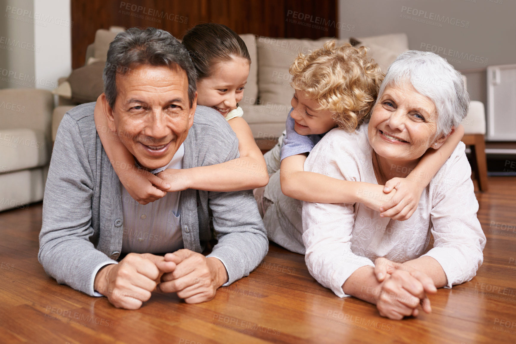 Buy stock photo Floor, piggyback or portrait of grandparents with happy kids playing or hugging with love in family home. Elderly grandma or fun old man relaxing or bonding to enjoy time with children in retirement 