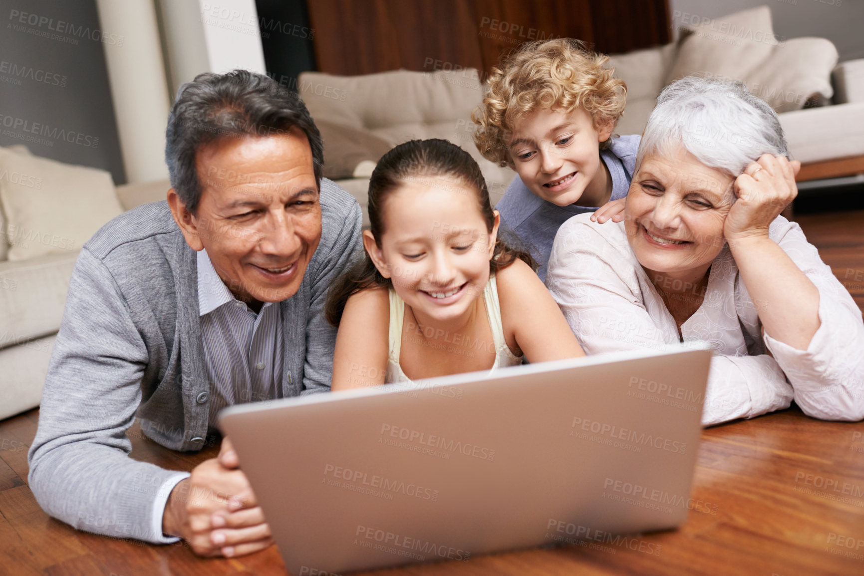 Buy stock photo Laptop, relax or grandparents with happy kids for movie streaming online subscription in a family at home. Children siblings, floor or grandmother watching videos in retirement with a senior old man