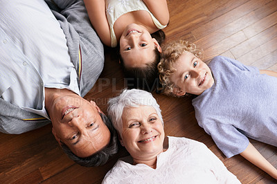 Buy stock photo Portrait, floor or top view of grandparents with happy kids smiling together in family home or retirement. Senior grandma, relax or fun children siblings bonding to enjoy quality time with old man