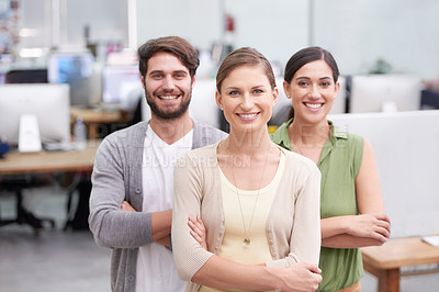 Buy stock photo Cropped shot of three work colleagues in the office
