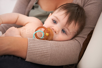 Buy stock photo Baby, parent and relax in arms with pacifier for childhood development or growth safety with love, caring or resting. Kid, dummy and together in apartment for bonding support, security or comfort