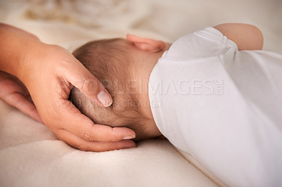 Buy stock photo Baby, sleeping and hands of parent on bed for care, love or support for protection in home. Kid, closeup or infant resting with family in bedroom for peace, calm or comfort of innocent child in house