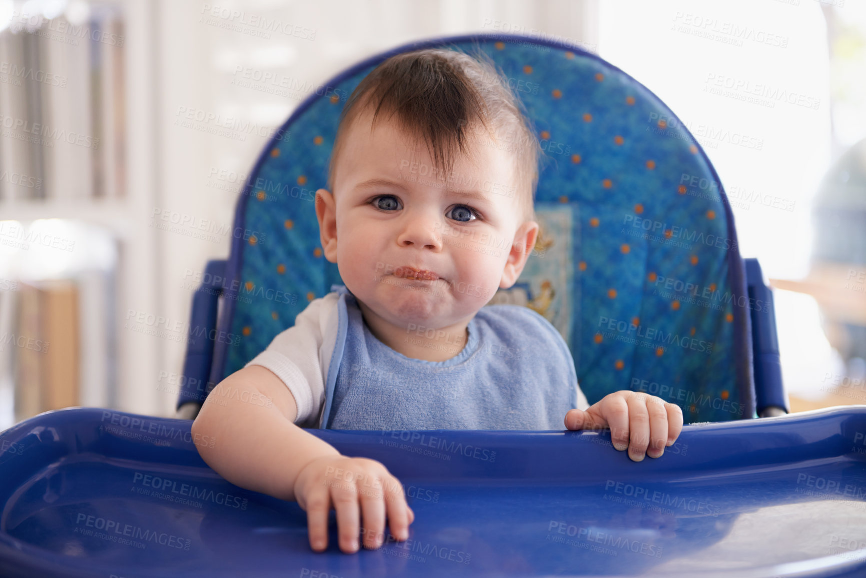 Buy stock photo Portrait of a baby boy in his high chair