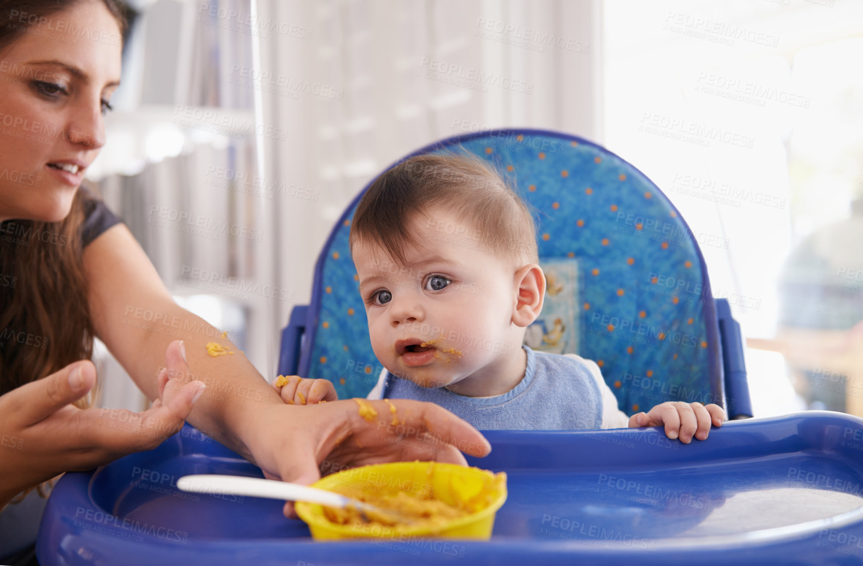 Buy stock photo Baby, mother and feeding food in kitchen or vegetable nutrition in high chair or breakfast eating, development or hungry. Child, parent and bowl for lunch wellness at home or fiber, vitamins or mess