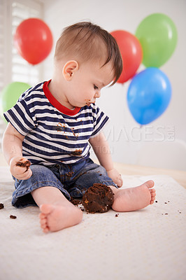 Buy stock photo Baby, birthday party and cake or mess eating by balloons or celebrating special day with dessert candy, sweets or event. Childhood, playing and dirty in home with snack or weekend, surprise or hungry