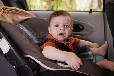 Buy stock photo Cropped shot a baby boy in a car seat
