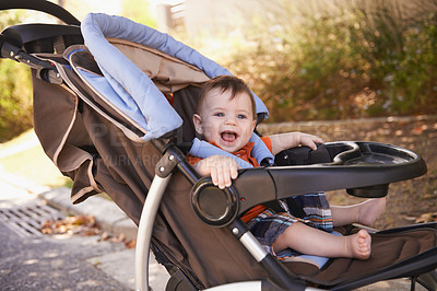 Buy stock photo Portrait of a baby boy sitting in a stroller