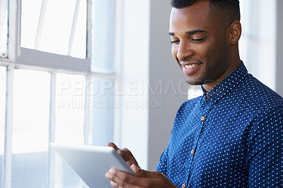 Buy stock photo Businessman, tablet and online at window for communication, internet search and networking in office. Entrepreneur, african employee and happy with technology for corporate email and planning at work