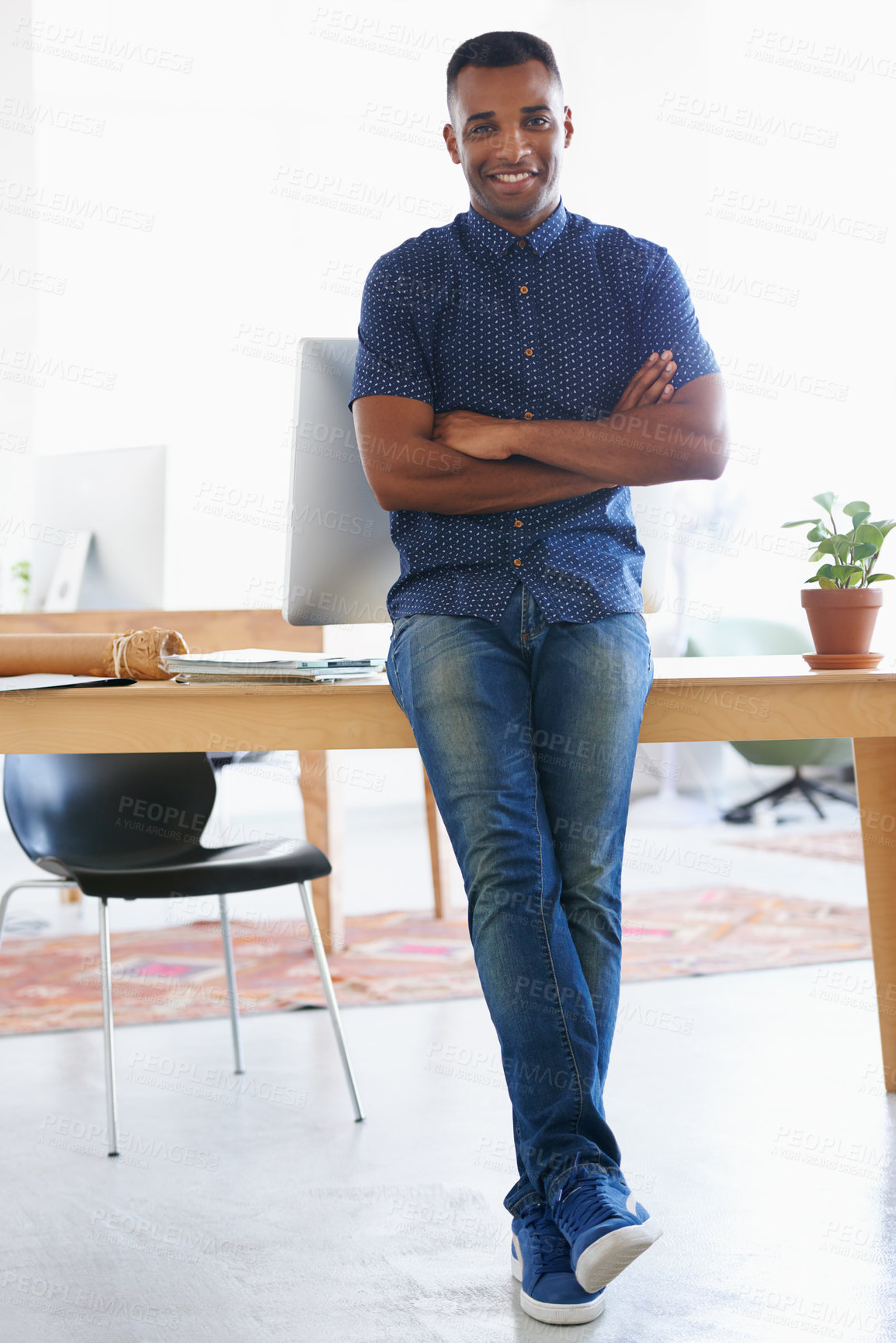 Buy stock photo Arms crossed, smile and portrait of man by desk in office for vision, web design or startup company. Happy, confident and creative person by table with technology for entrepreneur, research or pride