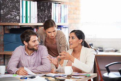 Buy stock photo Young creative professionals working in an office